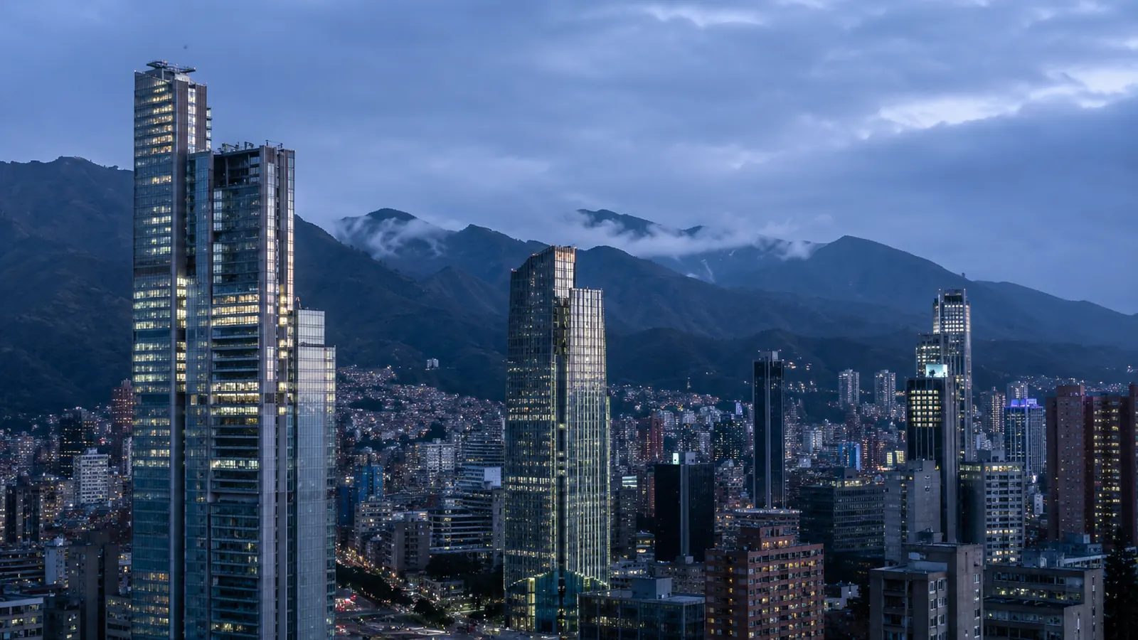 Bogotá skyline at dusk with the Andes behind